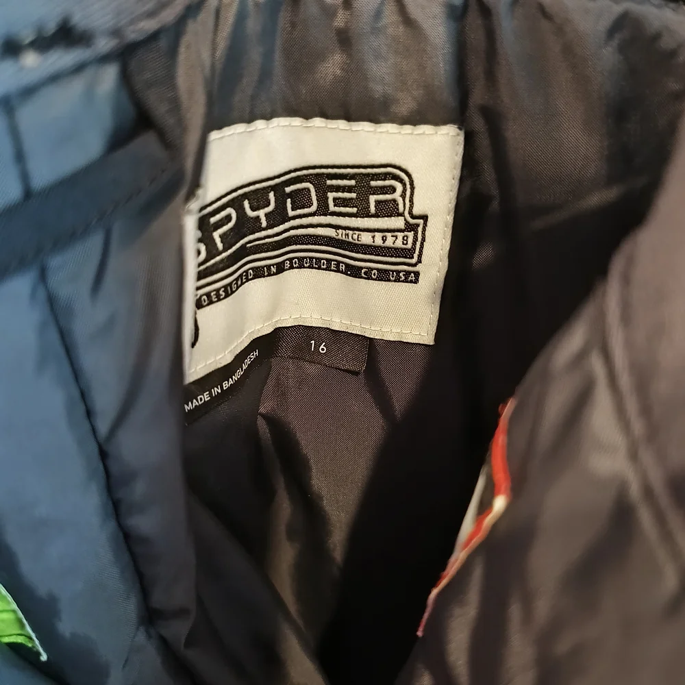 Spyder Orange and Blue Jacket with Black Pants - Picture 6 of 12